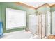 Bright bathroom featuring a shower and bathtub combo with a framed window at 5238 Downing Creek Dr, Charlotte, NC 28269