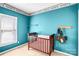 Small bedroom features sports themed wall decor, window, and carpet flooring at 5238 Downing Creek Dr, Charlotte, NC 28269