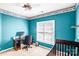 Small bedroom features sports themed wall decor, window, and carpet flooring at 5238 Downing Creek Dr, Charlotte, NC 28269