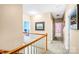 Upstairs hallway showcasing neutral walls, plush carpeting, and access to bedrooms and bathrooms at 5238 Downing Creek Dr, Charlotte, NC 28269