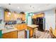 Spacious kitchen with wood cabinets, granite countertops, and a center island with seating at 5238 Downing Creek Dr, Charlotte, NC 28269