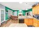 Open kitchen and living area with granite countertops, stainless steel appliances, and a cozy fireplace at 5238 Downing Creek Dr, Charlotte, NC 28269