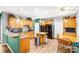 Cozy kitchen with wooden cabinets, granite countertops, stainless steel appliances, and a breakfast nook at 5238 Downing Creek Dr, Charlotte, NC 28269