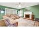 Comfortable living room features a fireplace and ample seating, perfect for relaxation at 5238 Downing Creek Dr, Charlotte, NC 28269