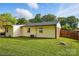Exterior view of home featuring a well-maintained lawn and partial fence at 529 Dedmon Dr, Charlotte, NC 28216