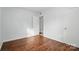 Bedroom featuring neutral walls, two closets, and wood-look flooring at 529 Dedmon Dr, Charlotte, NC 28216