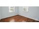 Bedroom with sleek window blinds and durable, wood-look flooring at 529 Dedmon Dr, Charlotte, NC 28216