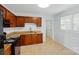 Well-lit kitchen with brown cabinets and granite countertops at 529 Dedmon Dr, Charlotte, NC 28216