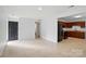 Open-concept living room with tile flooring leading into the kitchen at 529 Dedmon Dr, Charlotte, NC 28216