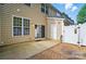 Relax on this backyard's patio featuring a privacy fence and convenient access to outdoor storage at 541 River Park Rd, Belmont, NC 28012