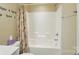 Bathroom with tub-shower combination and neutral-themed shower curtain at 541 River Park Rd, Belmont, NC 28012