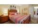 Bedroom featuring a patterned comforter, ceiling fan, and multiple decorative wall hangings at 541 River Park Rd, Belmont, NC 28012