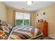 Inviting bedroom with natural light, window with shade and matching bedside tables offering a cozy space at 541 River Park Rd, Belmont, NC 28012