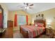 Cozy bedroom with vaulted ceiling, large window, and a queen-sized bed with patterned comforter at 541 River Park Rd, Belmont, NC 28012