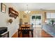 Bright dining room with wood floors, a view into living room, and sliding glass doors to the outside at 541 River Park Rd, Belmont, NC 28012