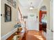 Foyer area featuring wood floors, staircase, and a decorative table, giving a glimpse into the home's interior at 541 River Park Rd, Belmont, NC 28012
