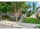 View of the home's front exterior showcasing well-maintained landscaping and a cozy front entrance with a small seating area at 541 River Park Rd, Belmont, NC 28012