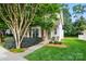 Charming home with a lush front yard and inviting entrance with decorative stone accents and a small sitting area at 541 River Park Rd, Belmont, NC 28012