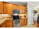 Kitchen with wood cabinets, stone countertops, stainless appliances and modern lighting at 541 River Park Rd, Belmont, NC 28012