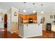 The kitchen offers stone countertops, stainless appliances, breakfast bar, and wood cabinets at 541 River Park Rd, Belmont, NC 28012
