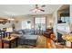Cozy living area with ample seating, a fireplace, and lots of light from the sliding doors and windows at 541 River Park Rd, Belmont, NC 28012