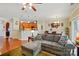 The great room has a sectional sofa, and a view to the kitchen and dining area at 541 River Park Rd, Belmont, NC 28012