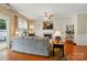 Inviting living room with a fireplace and ceiling fan and neutral colors and hardwood floors at 541 River Park Rd, Belmont, NC 28012