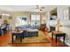 Cozy living area features a fireplace, ample seating, and bright windows, perfect for relaxing and entertaining at 541 River Park Rd, Belmont, NC 28012