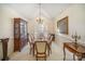 Spacious dining room featuring a large table, display cabinet, and elegant decor at 5550 Monticello Nw Dr, Concord, NC 28027