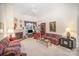 Bright living room with a fireplace, bookshelves, and ample seating for relaxation at 5550 Monticello Nw Dr, Concord, NC 28027