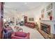 Open living room with fireplace, built-in shelving, and comfortable seating arrangement at 5550 Monticello Nw Dr, Concord, NC 28027