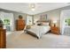 This bedroom offers abundant space, neutral tones, and a cozy atmosphere for rest and relaxation at 5716 Trimmings Ct, Charlotte, NC 28226