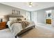 A charming bedroom featuring soft, neutral tones and plush bedding for a comfortable, inviting atmosphere at 5716 Trimmings Ct, Charlotte, NC 28226