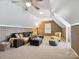 The bonus room features high ceilings, a ceiling fan, a comfortable sofa, and paneled walls at 5716 Trimmings Ct, Charlotte, NC 28226