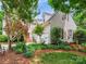 Beautiful two-story home with mature landscaping and a well-manicured lawn, creating a welcoming and picturesque setting at 5716 Trimmings Ct, Charlotte, NC 28226