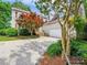 Charming two-story home with a well-maintained lawn and lush landscaping enhancing curb appeal at 5716 Trimmings Ct, Charlotte, NC 28226