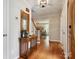 Warm and inviting foyer with hardwood floors and view to staircase and living room at 5716 Trimmings Ct, Charlotte, NC 28226