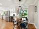 Eat-in kitchen area with a round table, black chairs, and a view of the backyard at 5716 Trimmings Ct, Charlotte, NC 28226
