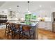 Bright kitchen features a large island, ample counter space, and modern appliances at 5716 Trimmings Ct, Charlotte, NC 28226