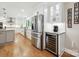 Spacious kitchen with stainless steel appliances, a wine cooler, and ample cabinet space at 5716 Trimmings Ct, Charlotte, NC 28226