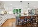 Spacious kitchen with white cabinets, granite countertops, and a large center island at 5716 Trimmings Ct, Charlotte, NC 28226