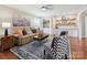 Cozy living room featuring a comfortable sofa, stylish armchairs, and a butler pantry at 5716 Trimmings Ct, Charlotte, NC 28226