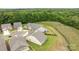 Aerial view of the property, highlighting its spacious lot and proximity to lush green spaces and other homes at 7010 Brush Crk, Monroe, NC 28110