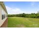 Spacious backyard with well-maintained lawn, mature trees, and plenty of room for outdoor activities at 7010 Brush Crk, Monroe, NC 28110