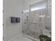Modern bathroom featuring a glass-enclosed shower with gray tile and a mosaic shower floor at 7010 Brush Crk, Monroe, NC 28110