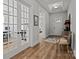 Elegant foyer with hardwood floors, tray ceiling, and French doors, creating a grand entrance to the home at 7010 Brush Crk, Monroe, NC 28110