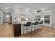 Stylish kitchen featuring white cabinets, stainless steel appliances, and a spacious island with bar seating at 7010 Brush Crk, Monroe, NC 28110