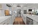 Well-appointed kitchen with white cabinetry, stainless steel appliances, and a center island for culinary enthusiasts at 7010 Brush Crk, Monroe, NC 28110