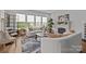 Bright living room featuring a fireplace, large windows, and comfortable seating arrangements for relaxation and socializing at 7010 Brush Crk, Monroe, NC 28110