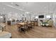 Bright living space showcasing an open layout with kitchen, dining area, and fireplace, perfect for modern living at 7010 Brush Crk, Monroe, NC 28110